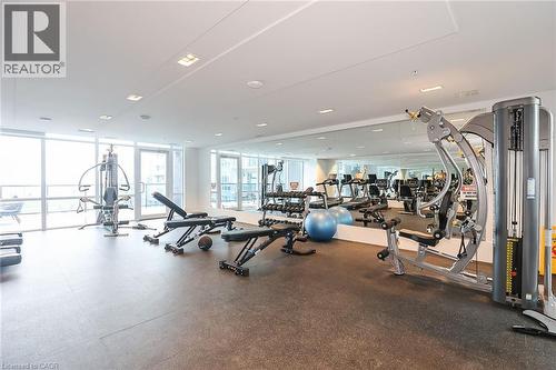 Workout area with expansive windows - 16 Concord Place Unit# 431, Grimsby, ON - Indoor Photo Showing Gym Room