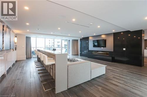 Cinema room with dark wood-style flooring - 16 Concord Place Unit# 431, Grimsby, ON - Indoor