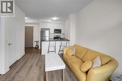 Living room with light wood-type flooring - 