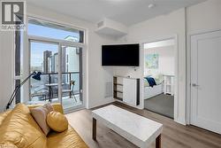 Living area featuring light wood-style flooring - 