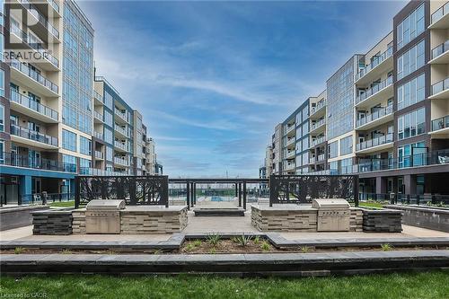 Surrounding community featuring area for grilling and a deck - 16 Concord Place Unit# 431, Grimsby, ON - Outdoor With Balcony