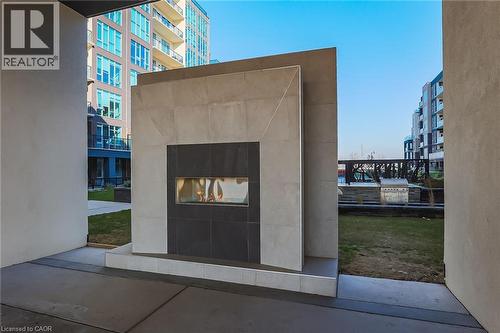 View of community - 16 Concord Place Unit# 431, Grimsby, ON - Indoor With Fireplace
