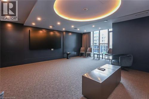 Common area with floor to ceiling windows and recessed lighting - 16 Concord Place Unit# 431, Grimsby, ON - Indoor Photo Showing Other Room