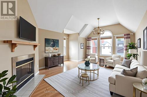 Secondary living room - Virtually staged - 6 Robina Avenue, Ottawa, ON - Indoor Photo Showing Living Room With Fireplace