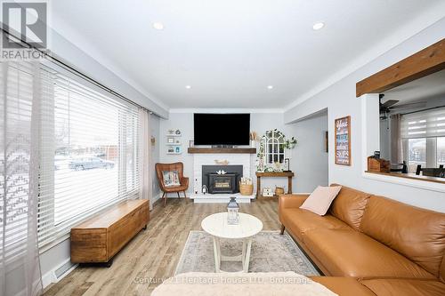 Living room with wood stove - 8845 Banting Avenue, Niagara Falls (Chippawa), ON - Indoor Photo Showing Living Room With Fireplace