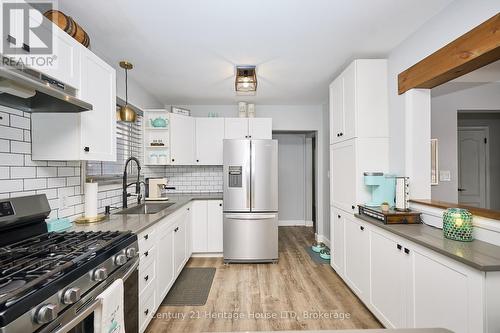 vinyl plank flooring throughout kitchen and mainfl - 8845 Banting Avenue, Niagara Falls (Chippawa), ON - Indoor Photo Showing Kitchen With Upgraded Kitchen