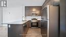 004 - 95 Dundas Street W, Oakville, ON  - Indoor Photo Showing Kitchen With Upgraded Kitchen 