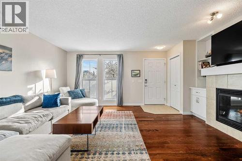 32 Auburn Bay Boulevard Se, Calgary, AB - Indoor Photo Showing Living Room With Fireplace