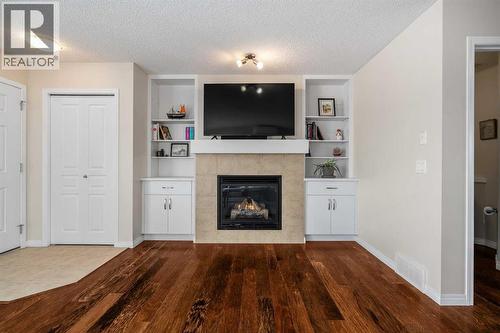 32 Auburn Bay Boulevard Se, Calgary, AB - Indoor Photo Showing Living Room With Fireplace
