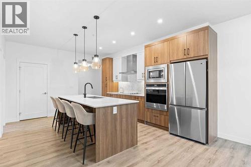 112, 40 Walgrove Walk Se, Calgary, AB - Indoor Photo Showing Kitchen With Upgraded Kitchen