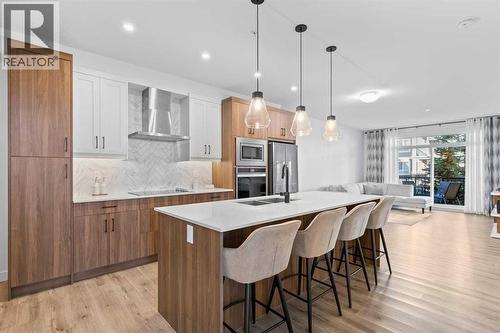 112, 40 Walgrove Walk Se, Calgary, AB - Indoor Photo Showing Kitchen With Upgraded Kitchen