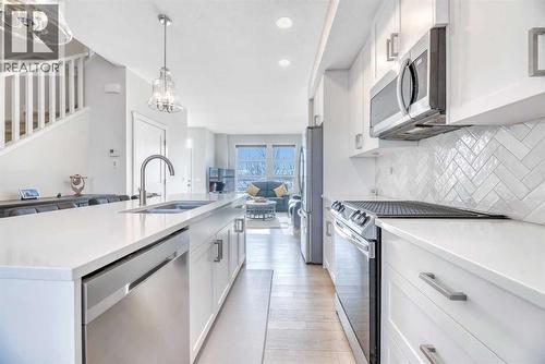 196 Wolf Hollow Park Se, Calgary, AB - Indoor Photo Showing Kitchen With Double Sink With Upgraded Kitchen