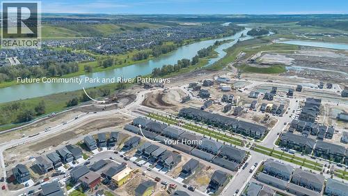 Just steps away from a newly developed park and river pathways - 196 Wolf Hollow Park Se, Calgary, AB - Outdoor With Body Of Water With View