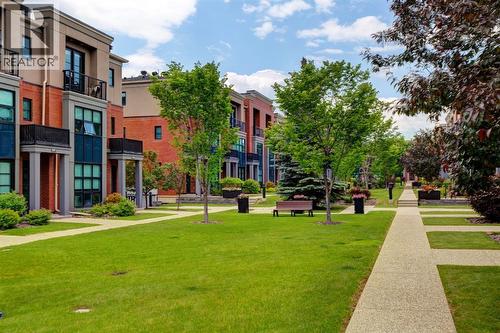 beautiful courtyard - 416 Aspen Meadows Hill Sw, Calgary, AB - Outdoor With Facade