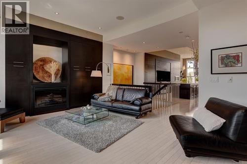lots of built-ins - 416 Aspen Meadows Hill Sw, Calgary, AB - Indoor Photo Showing Living Room With Fireplace