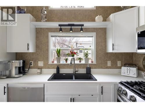 Updated kitchen cabinets, sink, and quartz counters - 8000 Highland Road Unit# 33, Vernon, BC 