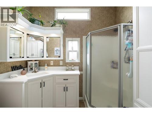 Functional bathroom with updates including quartz counter - 8000 Highland Road Unit# 33, Vernon, BC 