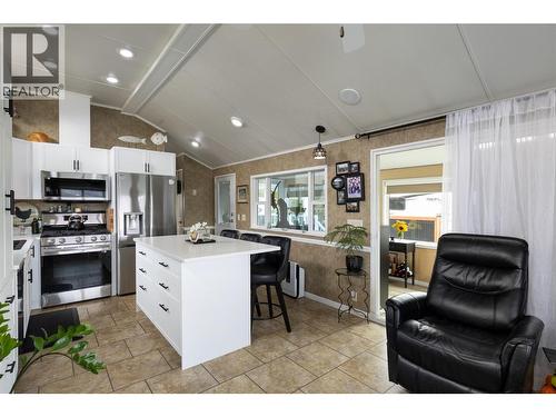 Kitchen with sit up island - 8000 Highland Road Unit# 33, Vernon, BC 