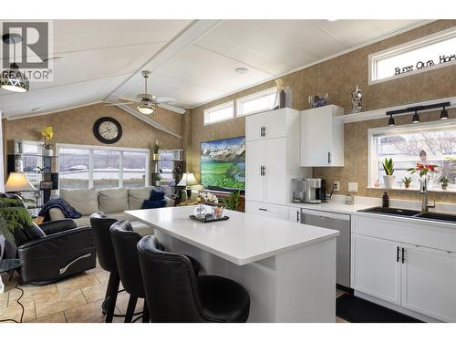 View from hall through kitchen to living room - 8000 Highland Road Unit# 33, Vernon, BC 