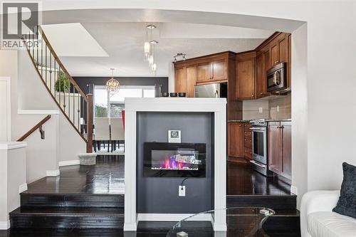 15 New Brighton Common Se, Calgary, AB - Indoor With Fireplace