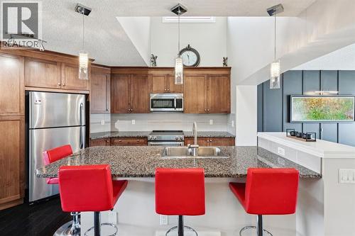 15 New Brighton Common Se, Calgary, AB - Indoor Photo Showing Kitchen With Upgraded Kitchen