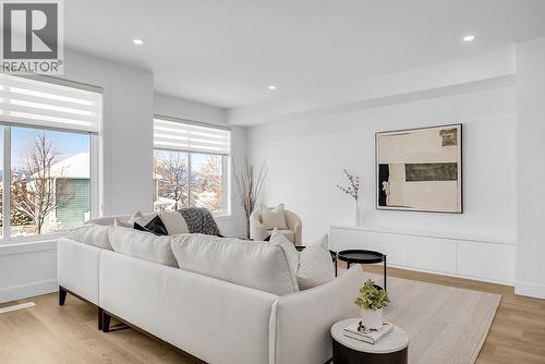 Photos are of a similar home in the community. - 5300 Main Street Unit# 115, Kelowna, BC - Indoor Photo Showing Living Room