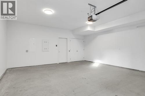 Photos are of a similar home in the community. - 5300 Main Street Unit# 115, Kelowna, BC - Indoor Photo Showing Garage
