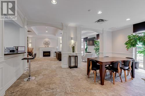 103 - 130 Pond Drive, Markham, ON - Indoor Photo Showing Dining Room With Fireplace