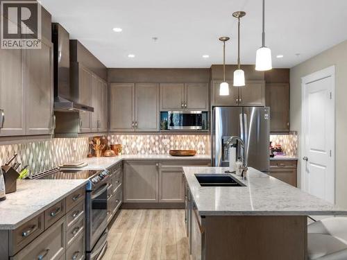 104-36 Waterfront Place, Whitehorse, YT - Indoor Photo Showing Kitchen With Stainless Steel Kitchen With Double Sink With Upgraded Kitchen