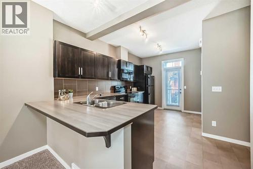 236 New Brighton Row Se, Calgary, AB - Indoor Photo Showing Kitchen With Double Sink