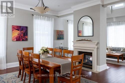 36 Sir Williams Lane, Toronto, ON - Indoor Photo Showing Dining Room With Fireplace