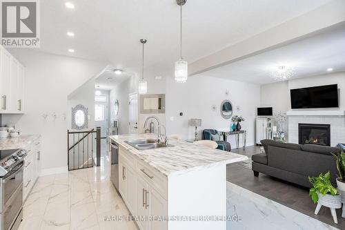13 Tindall Crescent, East Luther Grand Valley, ON - Indoor Photo Showing Kitchen With Fireplace With Double Sink With Upgraded Kitchen