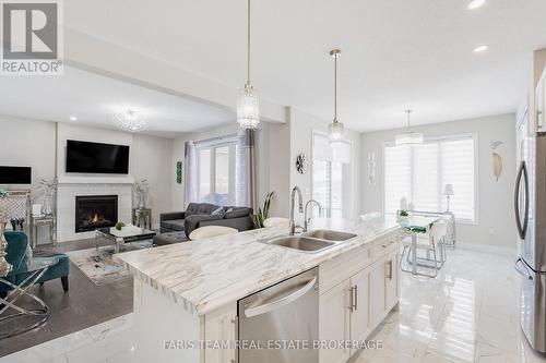 13 Tindall Crescent, East Luther Grand Valley, ON - Indoor Photo Showing Kitchen With Fireplace With Double Sink With Upgraded Kitchen