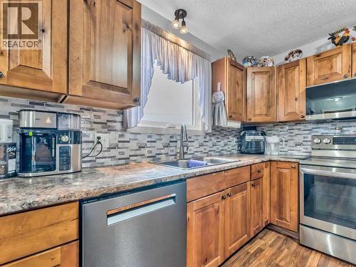 12002 Range Road 65, Rural Cypress County, AB - Indoor Photo Showing Kitchen With Double Sink