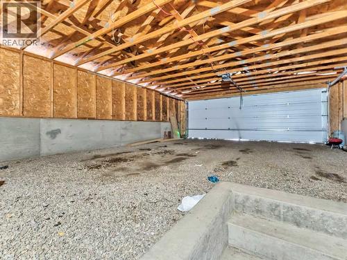 12002 Range Road 65, Rural Cypress County, AB - Indoor Photo Showing Garage