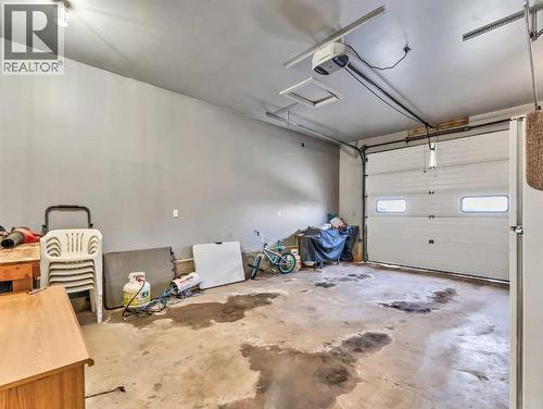 12002 Range Road 65, Rural Cypress County, AB - Indoor Photo Showing Garage