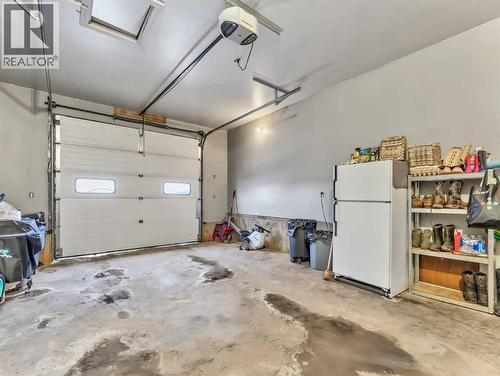 12002 Range Road 65, Rural Cypress County, AB - Indoor Photo Showing Garage