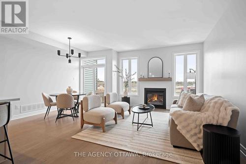 1150 Cope Drive, Ottawa, ON - Indoor Photo Showing Living Room With Fireplace