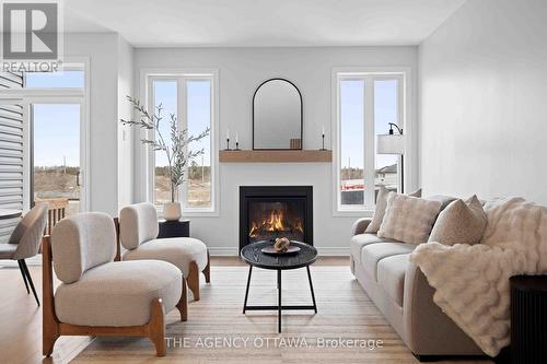 1150 Cope Drive, Ottawa, ON - Indoor Photo Showing Living Room With Fireplace