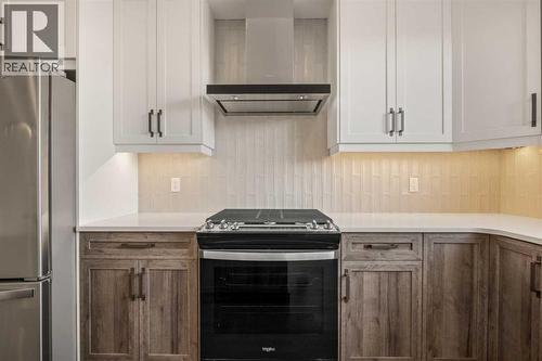 110 Wolf Creek Rise Se, Calgary, AB - Indoor Photo Showing Kitchen