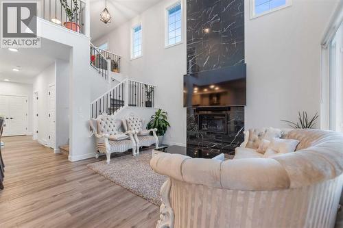 208 Dawson Circle, Chestermere, AB - Indoor Photo Showing Living Room With Fireplace