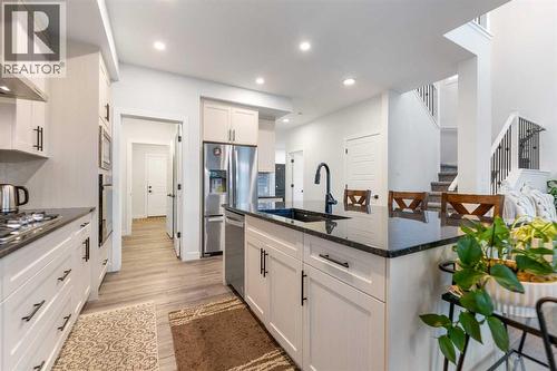 208 Dawson Circle, Chestermere, AB - Indoor Photo Showing Kitchen With Stainless Steel Kitchen With Upgraded Kitchen