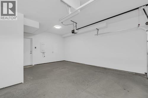Photo of a similar home in the community. - 5300 Main Street Unit# 103, Kelowna, BC - Indoor Photo Showing Garage