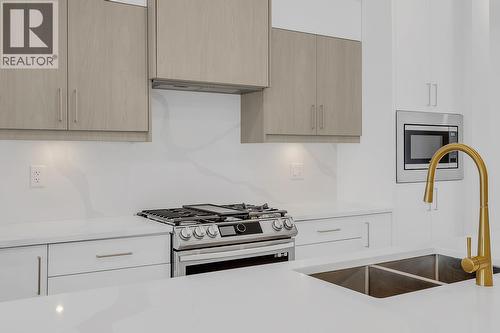 Photo of a similar home in the community. - 5300 Main Street Unit# 103, Kelowna, BC - Indoor Photo Showing Kitchen With Double Sink With Upgraded Kitchen