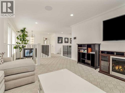 245 Prairie Rose Place S, Lethbridge, AB - Indoor Photo Showing Living Room With Fireplace