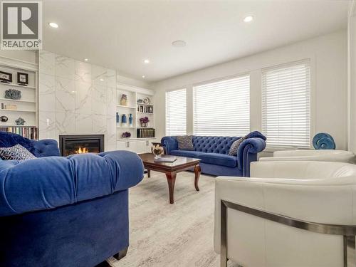 245 Prairie Rose Place S, Lethbridge, AB - Indoor Photo Showing Living Room With Fireplace
