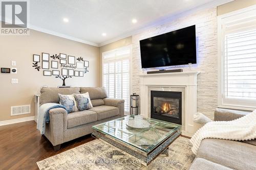 9 Broadpoint Street, Wasaga Beach, ON - Indoor Photo Showing Living Room With Fireplace