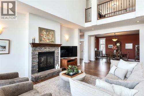 82 Auburn Sound Landing Se, Calgary, AB - Indoor Photo Showing Living Room With Fireplace
