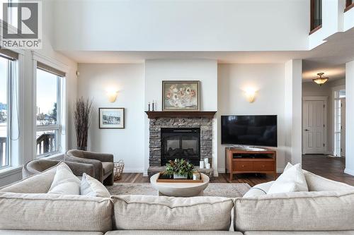 82 Auburn Sound Landing Se, Calgary, AB - Indoor Photo Showing Living Room With Fireplace