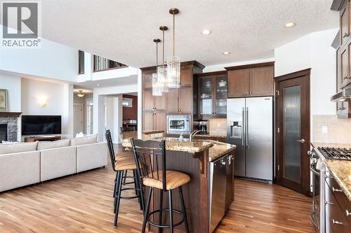 82 Auburn Sound Landing Se, Calgary, AB - Indoor Photo Showing Kitchen With Fireplace With Stainless Steel Kitchen With Upgraded Kitchen